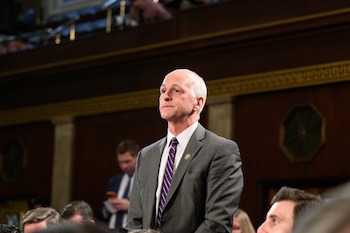 Congressman Adam Smith on the House floor